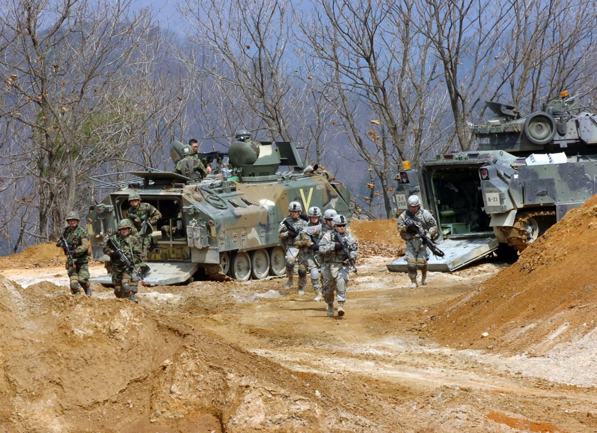 Mechanized infantry deploying